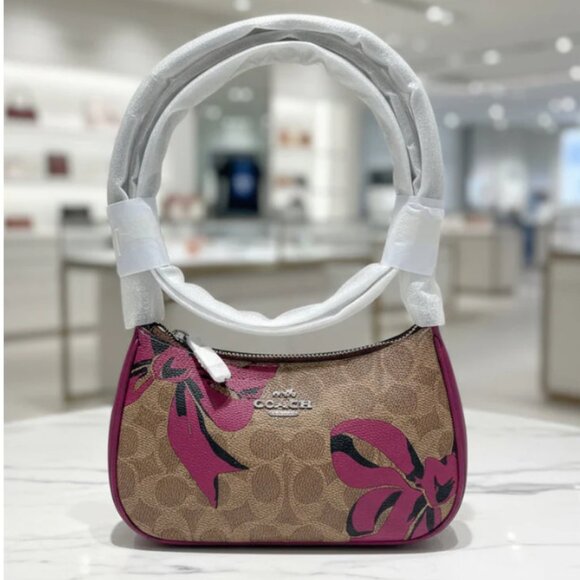 Coach Handbags - Coach Teri Mini Crossbody Brown Signature Canvas Red Bow Print CY733